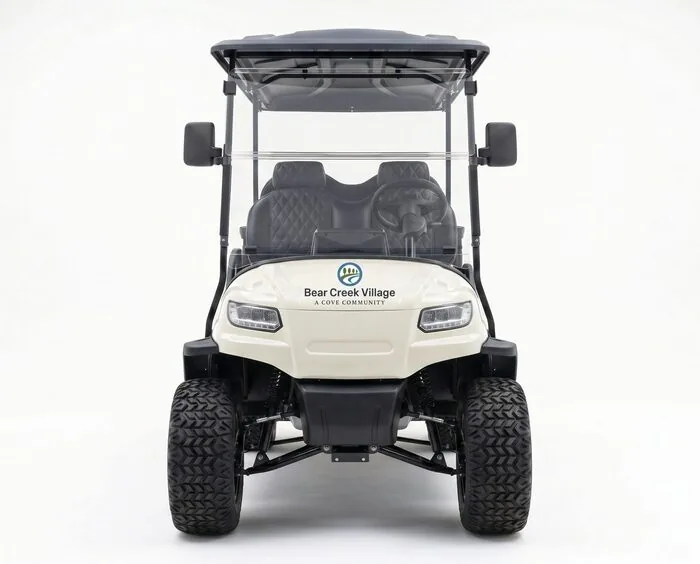 Six-seat golf cart, front view, decal treatment on a cream chassis