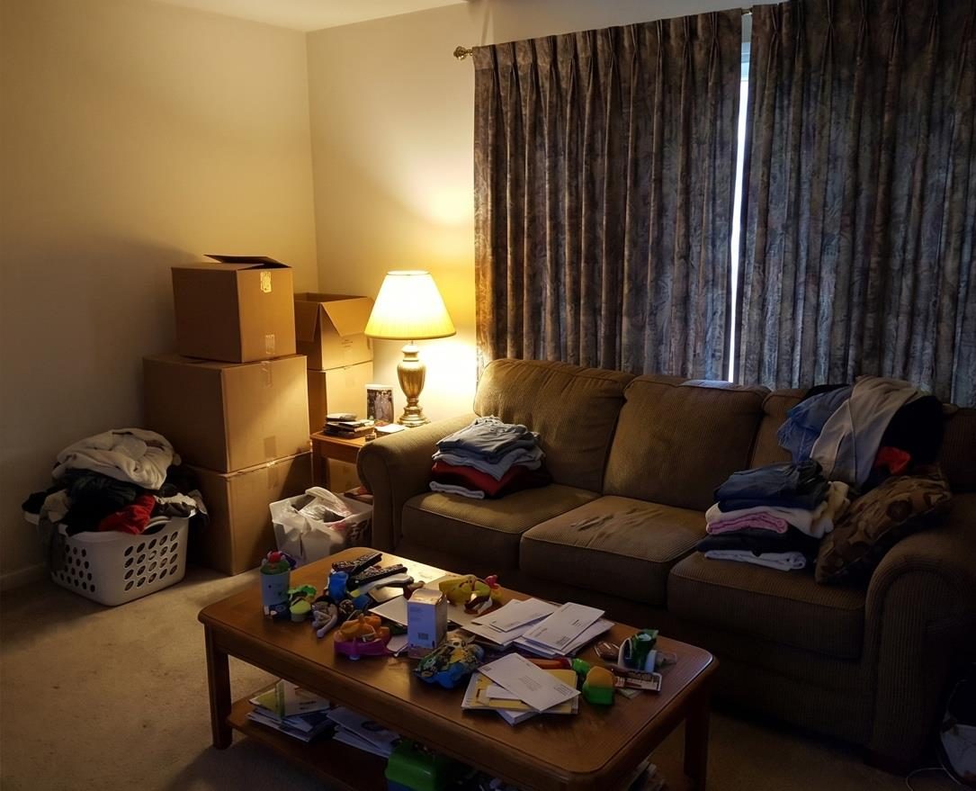 Cluttered, dim living room